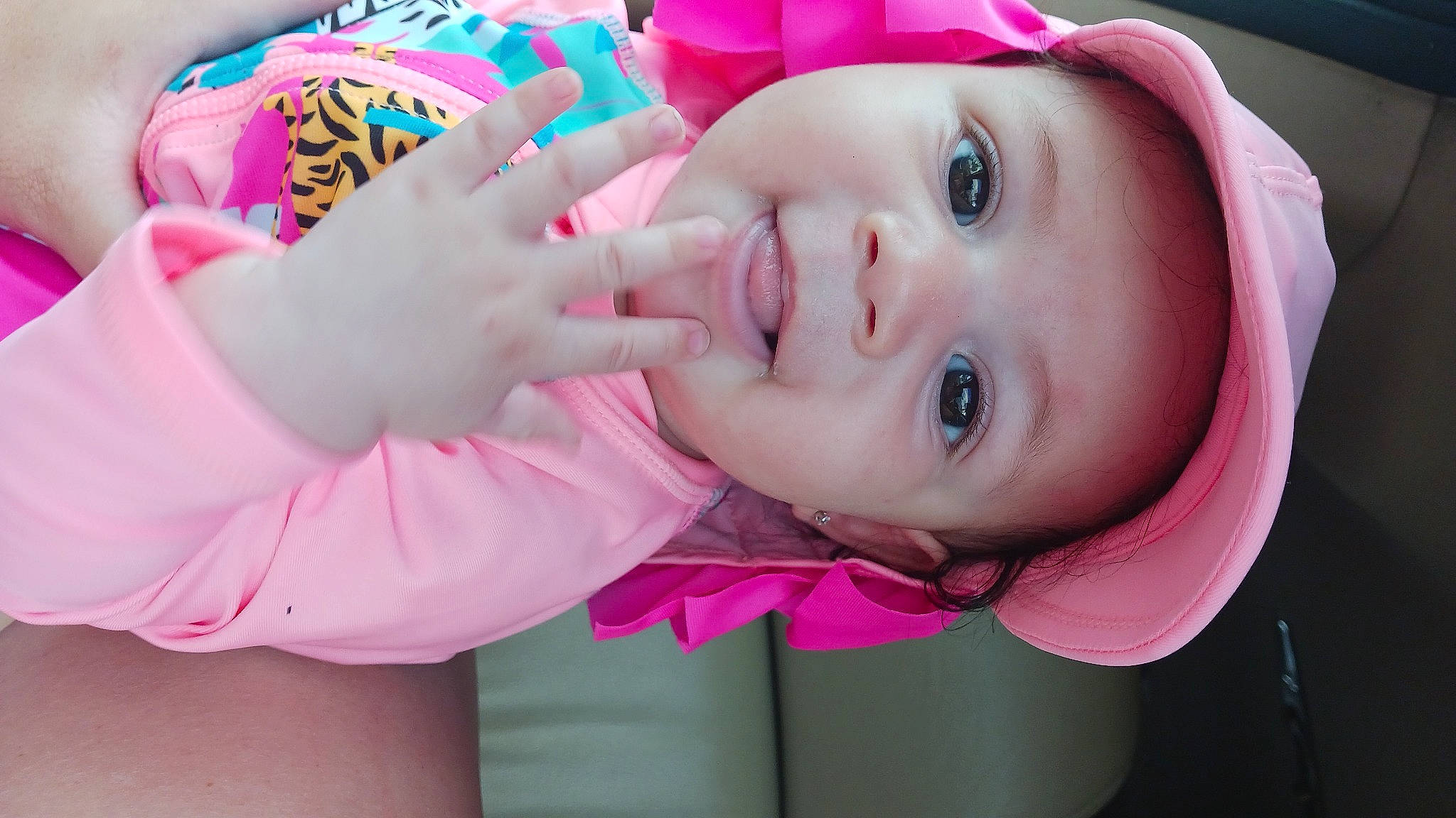 Faithlyn is registered to the contest to win money with this photo: baby, cheek, child, eye, eyebrow, eyelash, gesture, happy, hat, headgear, headwear, human_body, iris, lip, magenta, mouth, nose, person, pink, skin