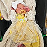 baby, newborn, pacifier, headband, bow, dress, yellow_dress, lace, blanket, car_seat, sleeping, infant, cute, cozy, foot, hand, clothing, soft, child, indoors