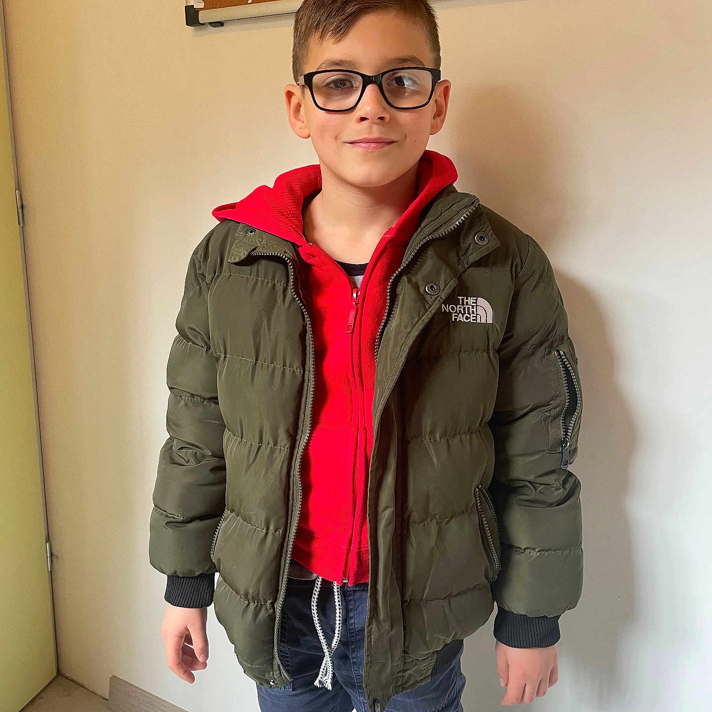 Nolan participe au concours pour gagner de l'argent avec cette photo : accessories, blazer, boy, child, clothing, coat, face, head, hood, jacket, knitwear, male, overcoat, pants, person, sleeve, standing, sweater, sweatshirt, vest
