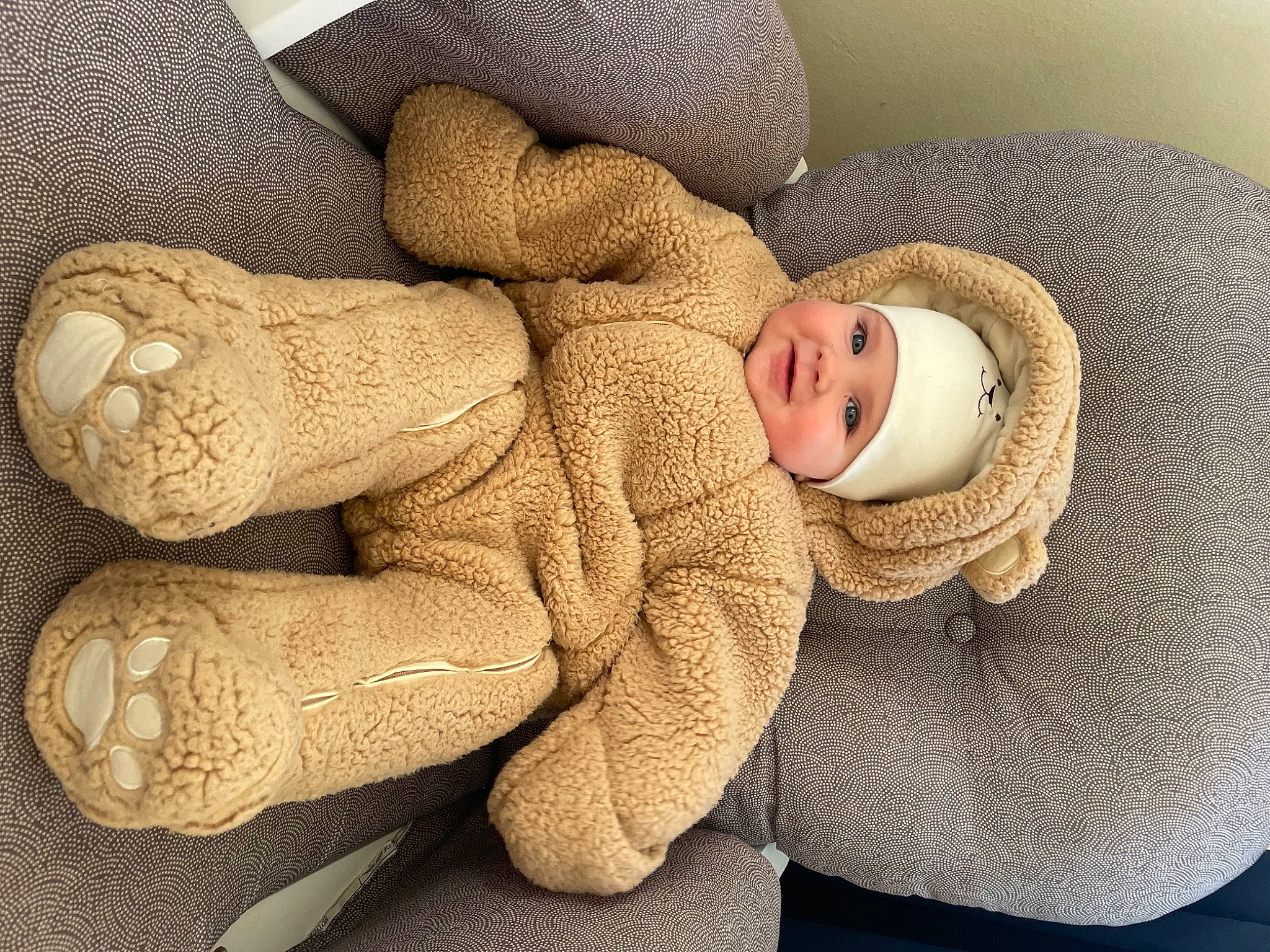 Sean is registered to the contest to win money with this photo: art, baby, baby_products, baby_sleeping, baby_toddler_clothing, beanie, cap, comfort, fur, gesture, head, headgear, headwear, knit_cap, linens, mammal, person, smile, thumb, toddler