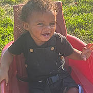 Aviaire joined the competition — help win amazing prizes! toddler, child, smiling, curly_hair, outdoor, sunlight, red_seat, grass, happy, black_clothing, baby, seatbelt, playtime, young_child, portrait, person, daylight, nature, cute, casual