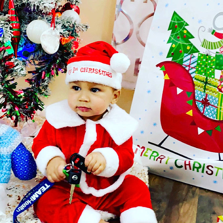 Alexei joined the competition — help win amazing prizes! baby, baby_toddler_clothing, bird, christmas, christmas_decoration, christmas_eve, christmas_ornament, christmas_tree, costume_hat, event, fictional_character, happy, headwear, holiday, holiday_ornament, ornament, person, red, santa_claus, sleeve