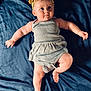 Merclynn joined the competition — help win amazing prizes! baby, infant, child, headband, bow, dress, blue_background, skin, barefoot, cute, lying_down, expression, soft_lighting, portrait, young_child, chubby_arms, chubby_legs, indoors, fabric, playful
