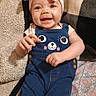 Aubree joined the competition — help win amazing prizes! baby, child, smile, headband, bow, overalls, blue_overalls, cute, happy, lying_down, blanket, patterned_blanket, cozy, infant, clothing, face, portrait, indoors, playful, adorable