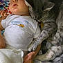 animal, baby, bed, blanket, cat, clothing, couch, cushion, face, furniture, hat, head, homedecor, kitten, newborn, person, pet, photography, portrait, sleeping