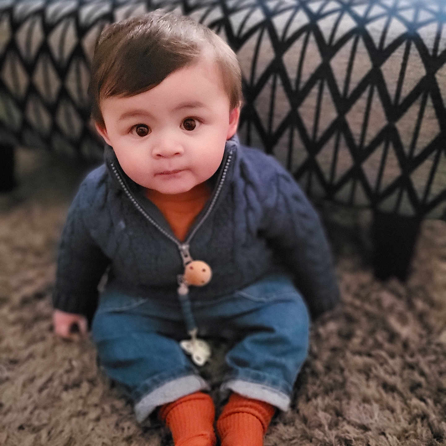 Fenn is registered to the contest to win money with this photo: baby, bodypart, clothing, coat, crawling, face, finger, hand, head, hosiery, jacket, jeans, knitwear, pants, person, photography, portrait, sitting, sock, sweater