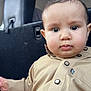 Ismail joined the competition — help win amazing prizes! baby, beige, buttoned_shirt, car_interior, child, chubby_cheeks, closeup, clothing, curious, cute, eyes, face, head, indoors, infant, person, portrait, sitting, young, young_child