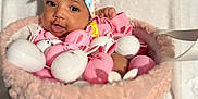 Genesis is registered to the contest to win money with this photo: baby, headband, basket, pink, white, eggs, bunny, cute, child, infant, smiling, face, soft, fabric, playful, holiday, easter, decor, indoors, portrait