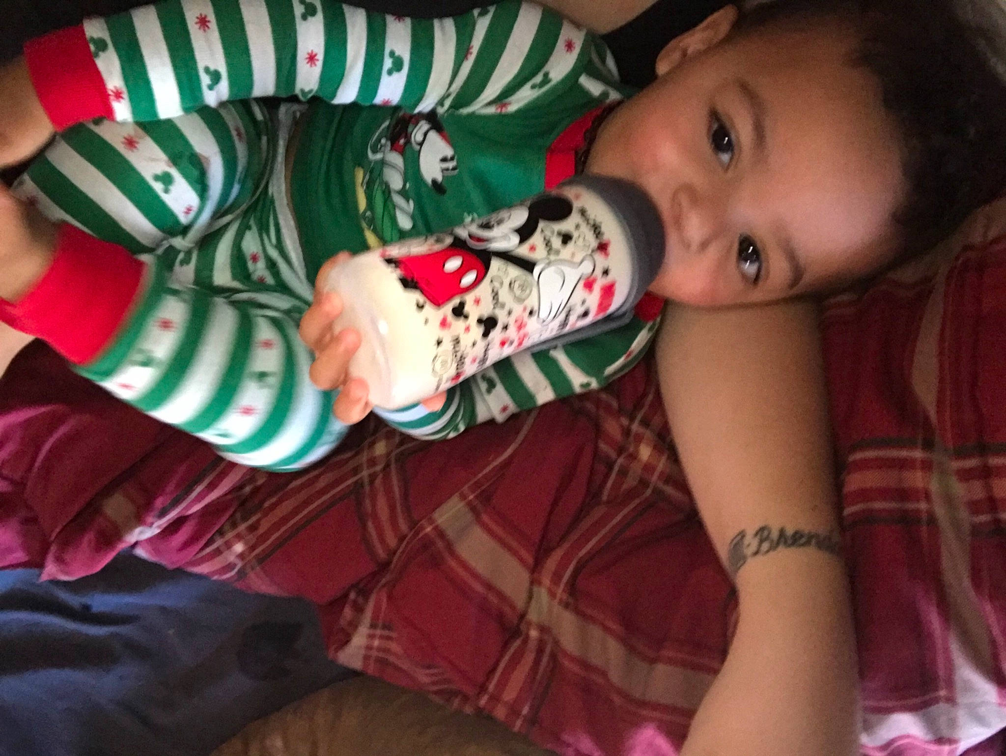 Jamal is registered to the contest to win money with this photo: baby_toddler_clothing, bracelet, carmine, design, nail, nightwear, pattern, person, plaid, tartan, walking_shoe