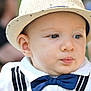 baby, blue_eyes, bow_tie, child, close_up, cute, expression, face, fashion, hat, headwear, infant, outdoor, person, portrait, skin, soft_lighting, suspenders, white_shirt, young_child