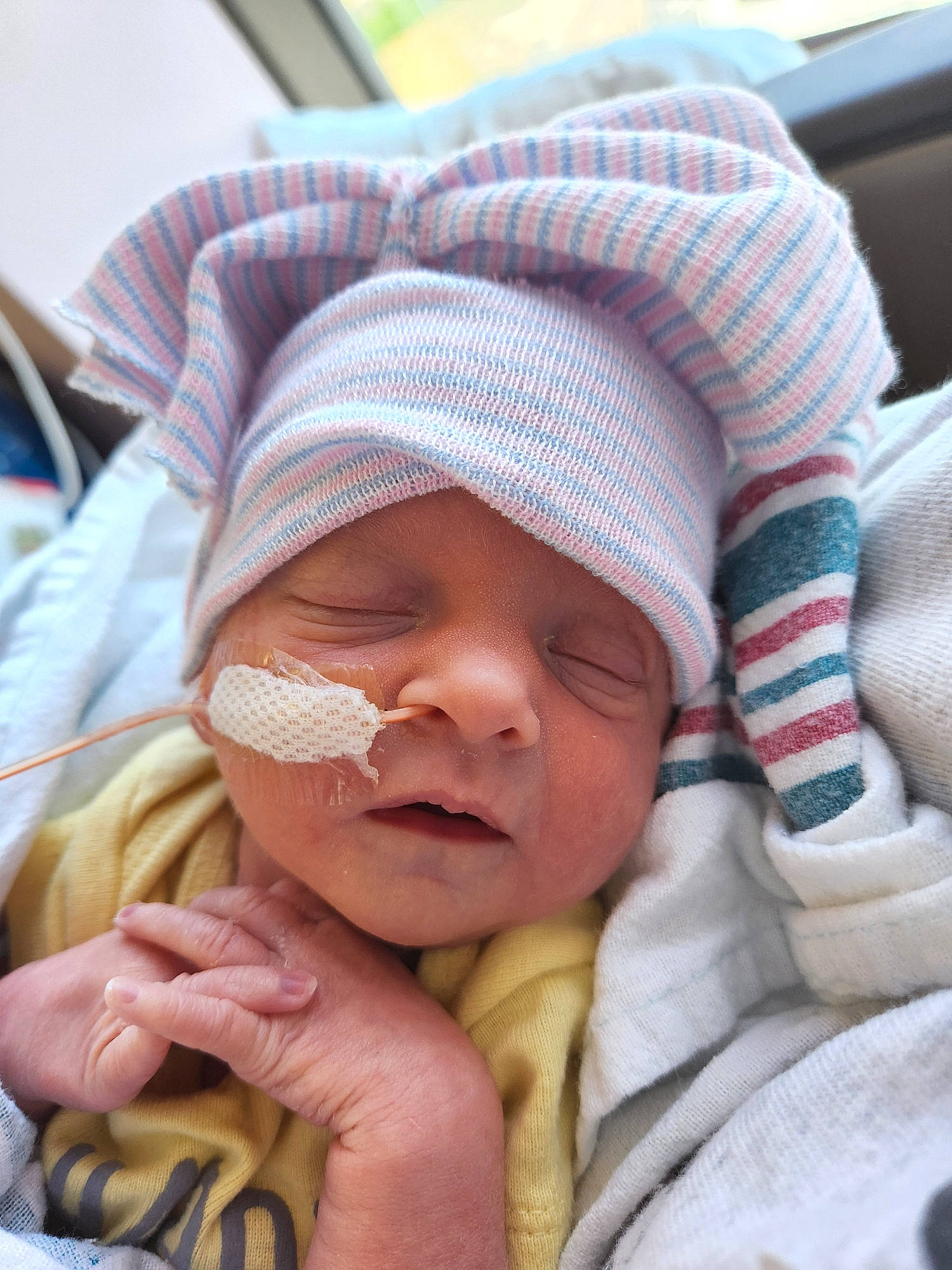 Cassie is registered to the contest to win money with this photo: baby, baby_products, baby_sleeping, baby_toddler_clothing, cap, cheek, child, comfort, finger, gesture, hand, happy, hat, headwear, linens, lip, person, photograph, skin, thumb