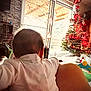 arm, baby, back_view, celebration, child, christmas_tree, cozy, decoration, family, festive, furniture, holiday_decor, home, indoor, leg, lighting, person, seasonal, toy, window