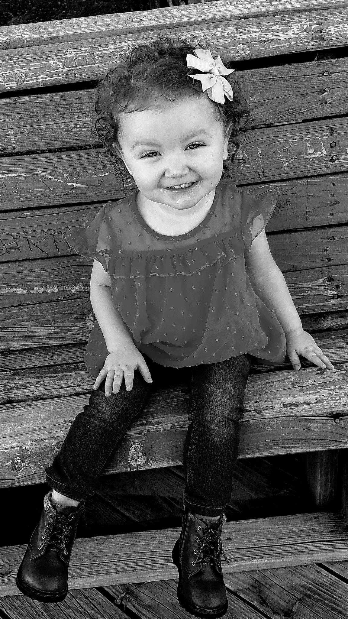 Avah joined the competition — help win amazing prizes! baby_toddler_clothing, black, black_and_white, face, facial_expression, flash_photography, hairstyle, head, iris, joy, leg, organ, person, photograph, plant, skin, sleeve, smile, standing, style