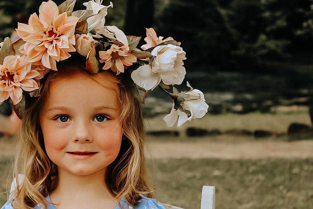 Gwendolyn joined the competition — help win amazing prizes! artificial_flower, baby, blossom, bouquet, branch, event, flash_photography, flower, flower_arranging, grass, happy, headband, headgear, headpiece, headwear, iris, joy, people_in_nature, person, petal