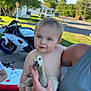 animal, baby_goose, blue_eyes, casual, child, cute, grass, happy, holding, motorcycle, nature, outdoor, person, portrait, street, summer, sunlight, tattoo, toddler, tree