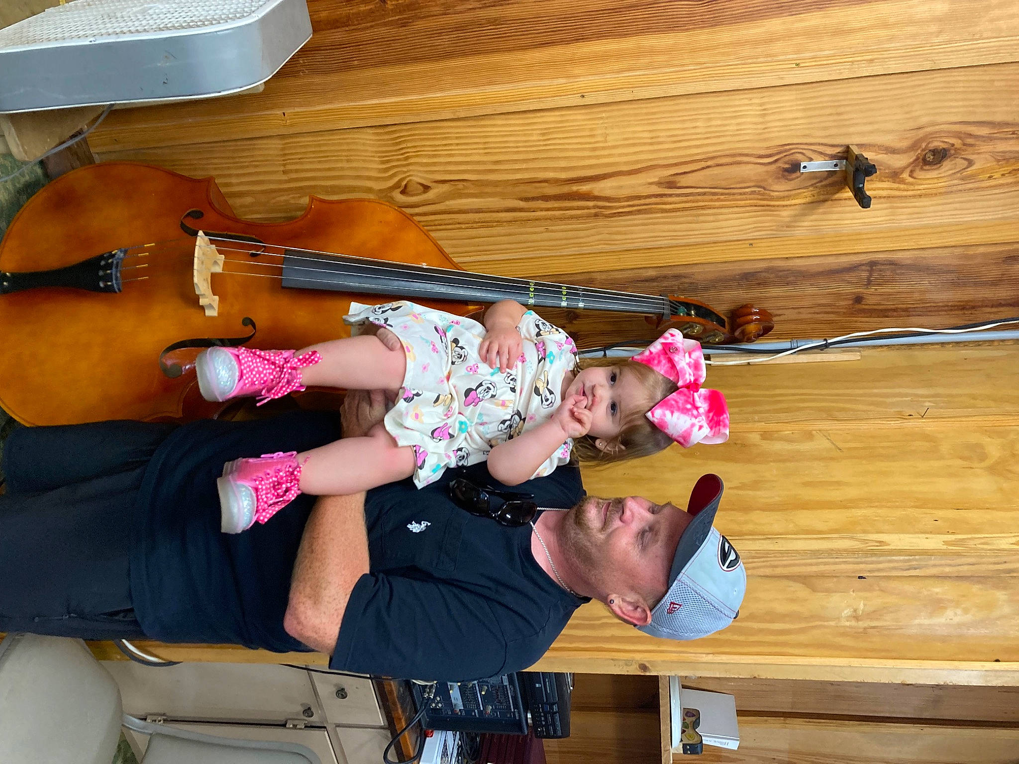 Emerald is registered to the contest to win money with this photo: child, folk_instrument, fun, hardwood, hat, headwear, leisure, lumber, music, musical_instrument, person, plank, plywood, smile, string_instrument, thigh, toddler, varnish, violin, violin_family
