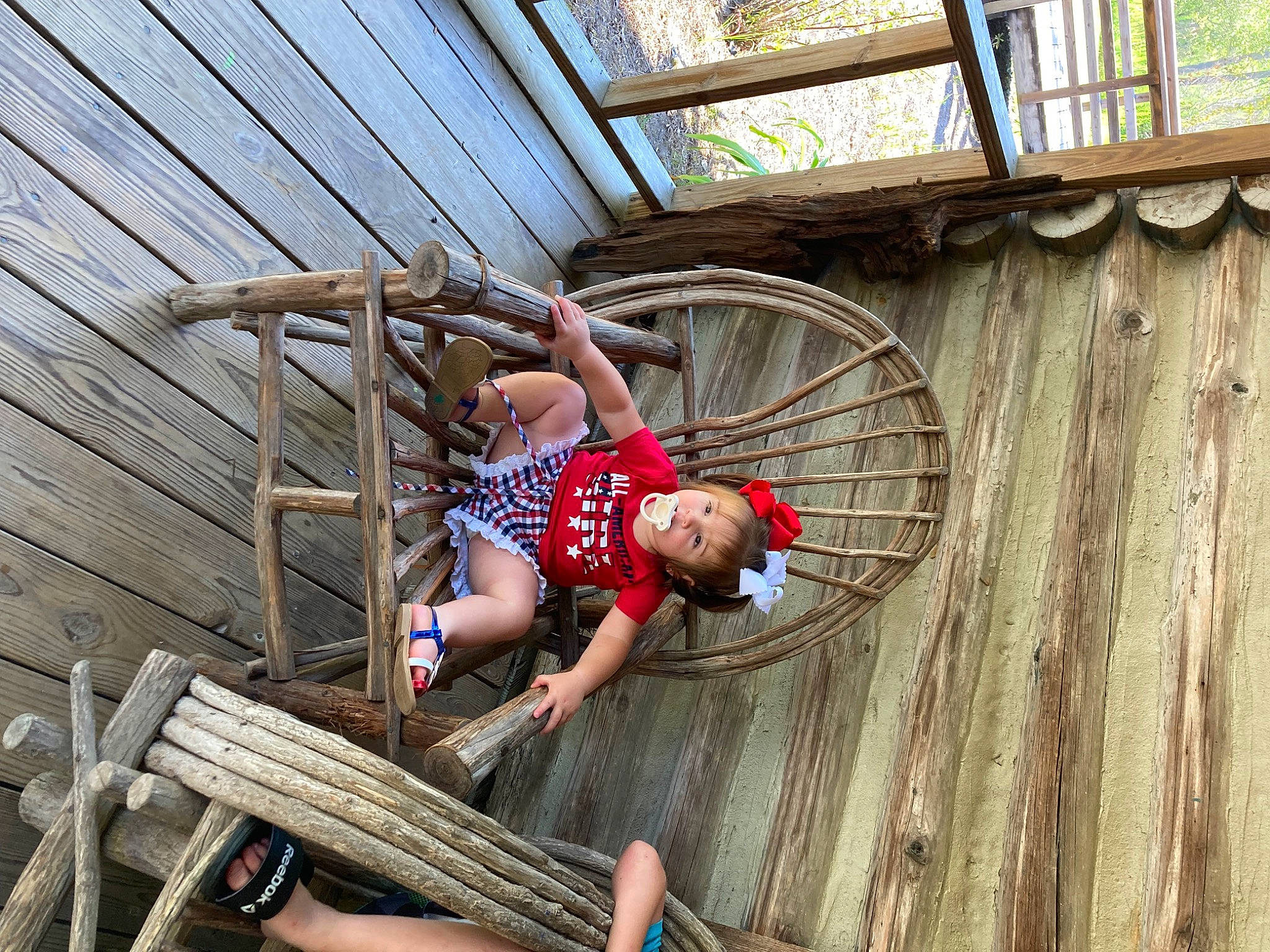 Emerald is registered to the contest to win money with this photo: automotive_wheel_system, deck, fun, hardwood, leisure, lumber, person, plank, shorts, spoke, thigh, tire, wheel, wood, wood_stain