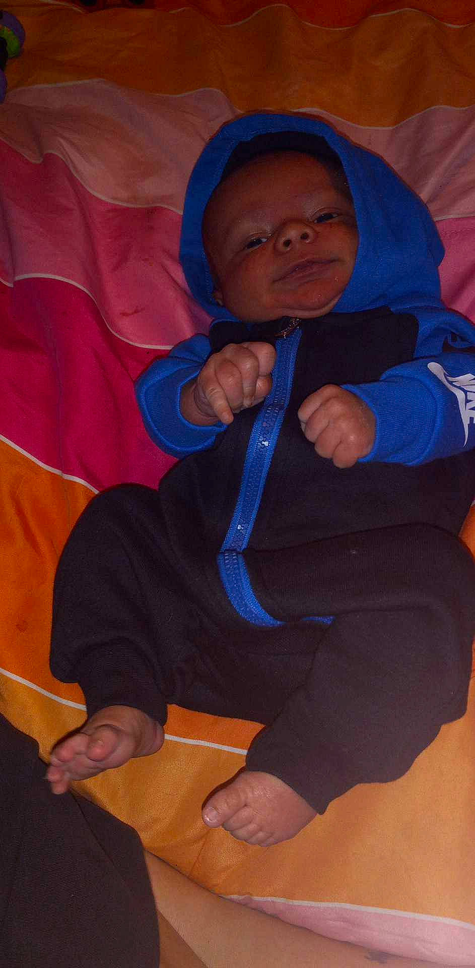 Marcus joined the competition — help win amazing prizes! baby, baby_products, child, comfort, electric_blue, finger, fun, headgear, hoodie, human_body, linens, orange, outerwear, person, play, room, sitting, sleeve, thigh, thumb