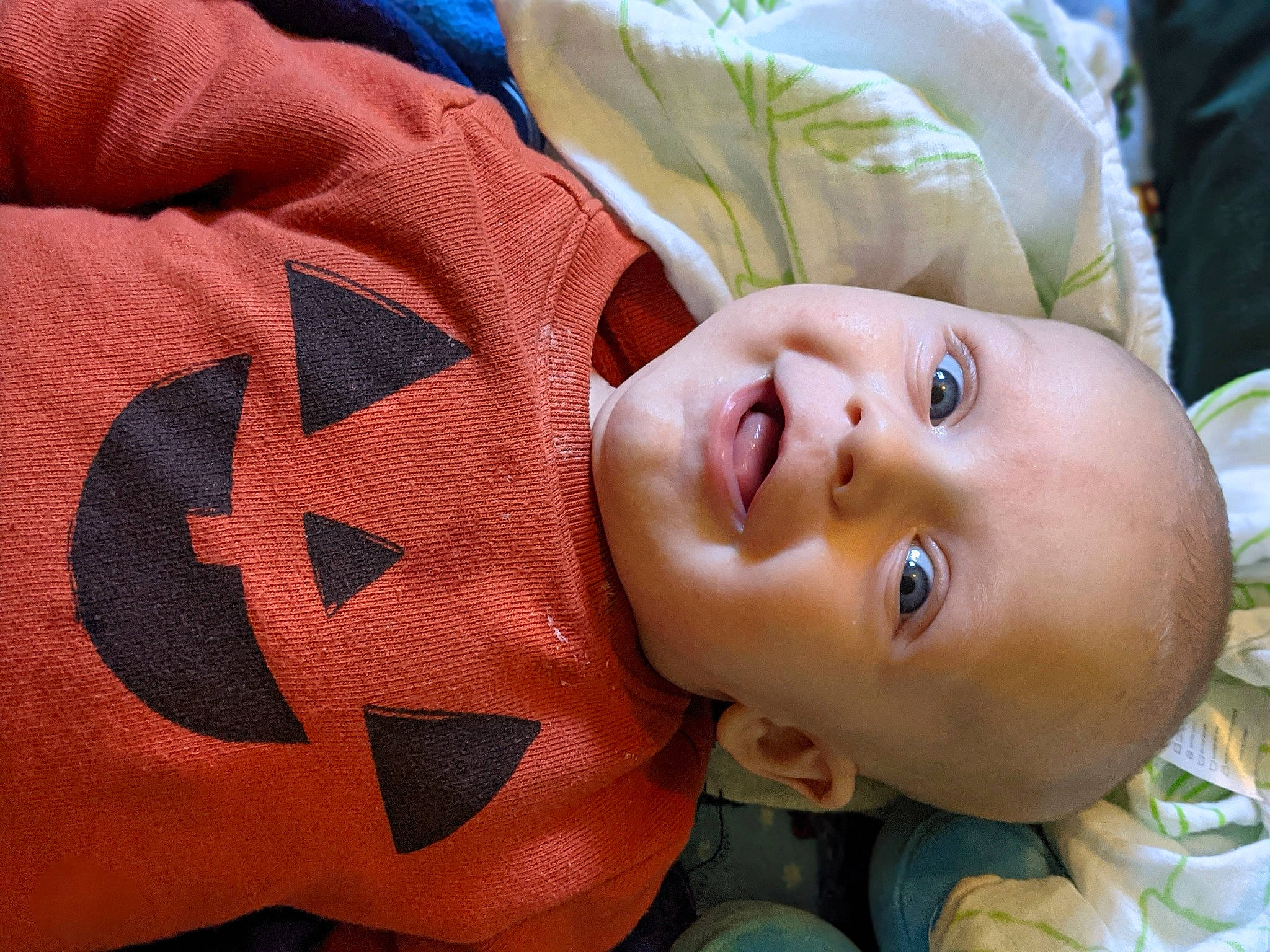 Damon joined the competition — help win amazing prizes! baby, cheek, chin, facial_expression, happy, human, human_body, lip, mammal, mouth, muscle, neck, nose, orange, person, product, skin, sleeve, smile, textile