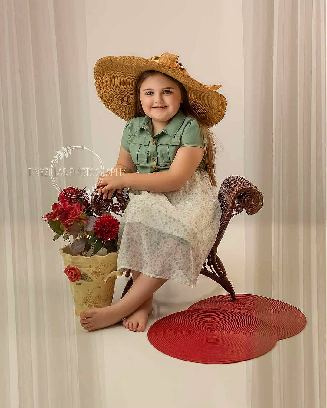 Ava is registered to the contest to win money with this photo: chair, cowboy_hat, day_dress, dress, fashion_design, fawn, flower, hat, headwear, human_leg, joy, knee, leg, pattern, person, pink, plant, shoe, sleeve, smile