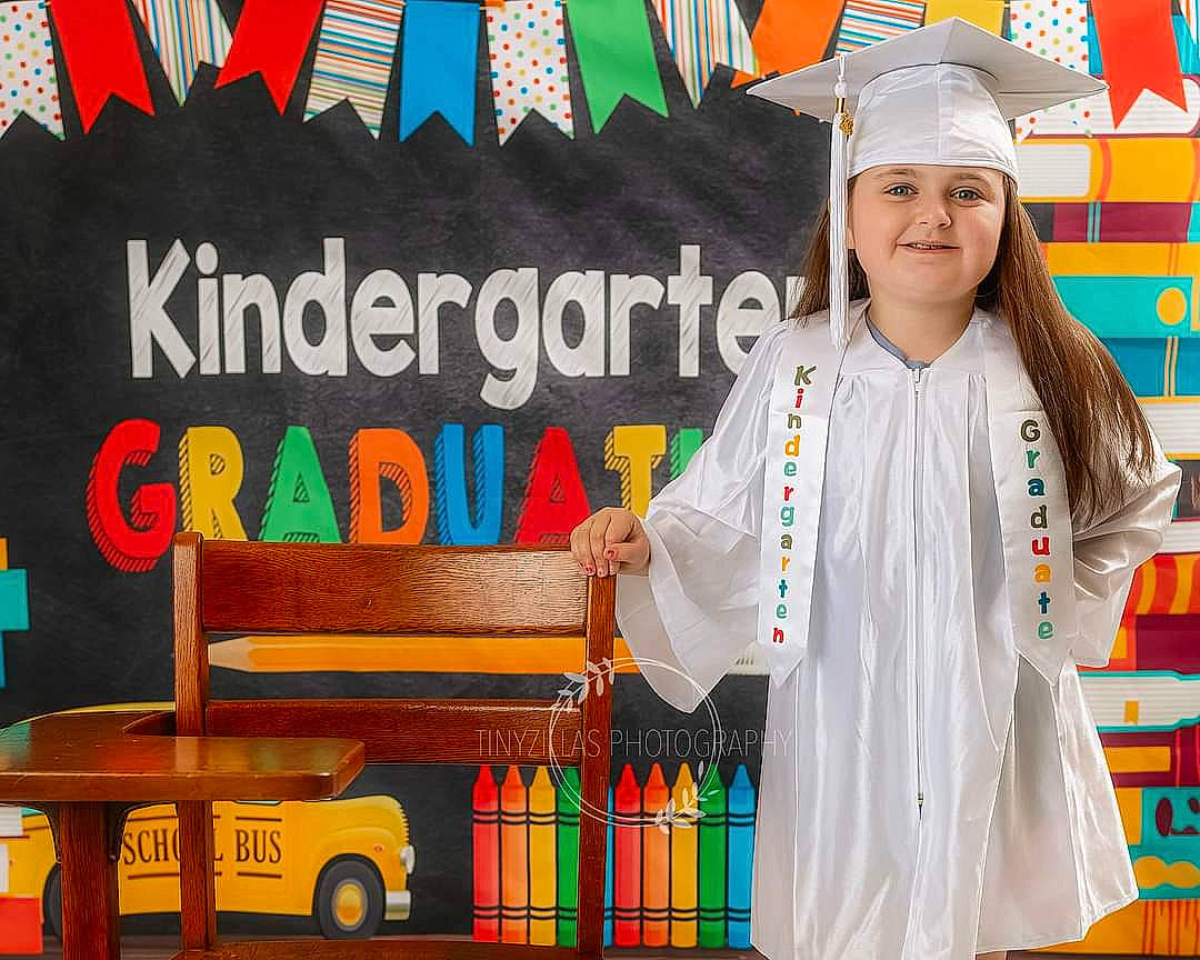 Ava is registered to the contest to win money with this photo: advertising, chef, cook, event, font, happy, headwear, joy, motor_vehicle, musical_instrument, person, room, smile, t_shirt, tire, uniform, vehicle, wheel, wood