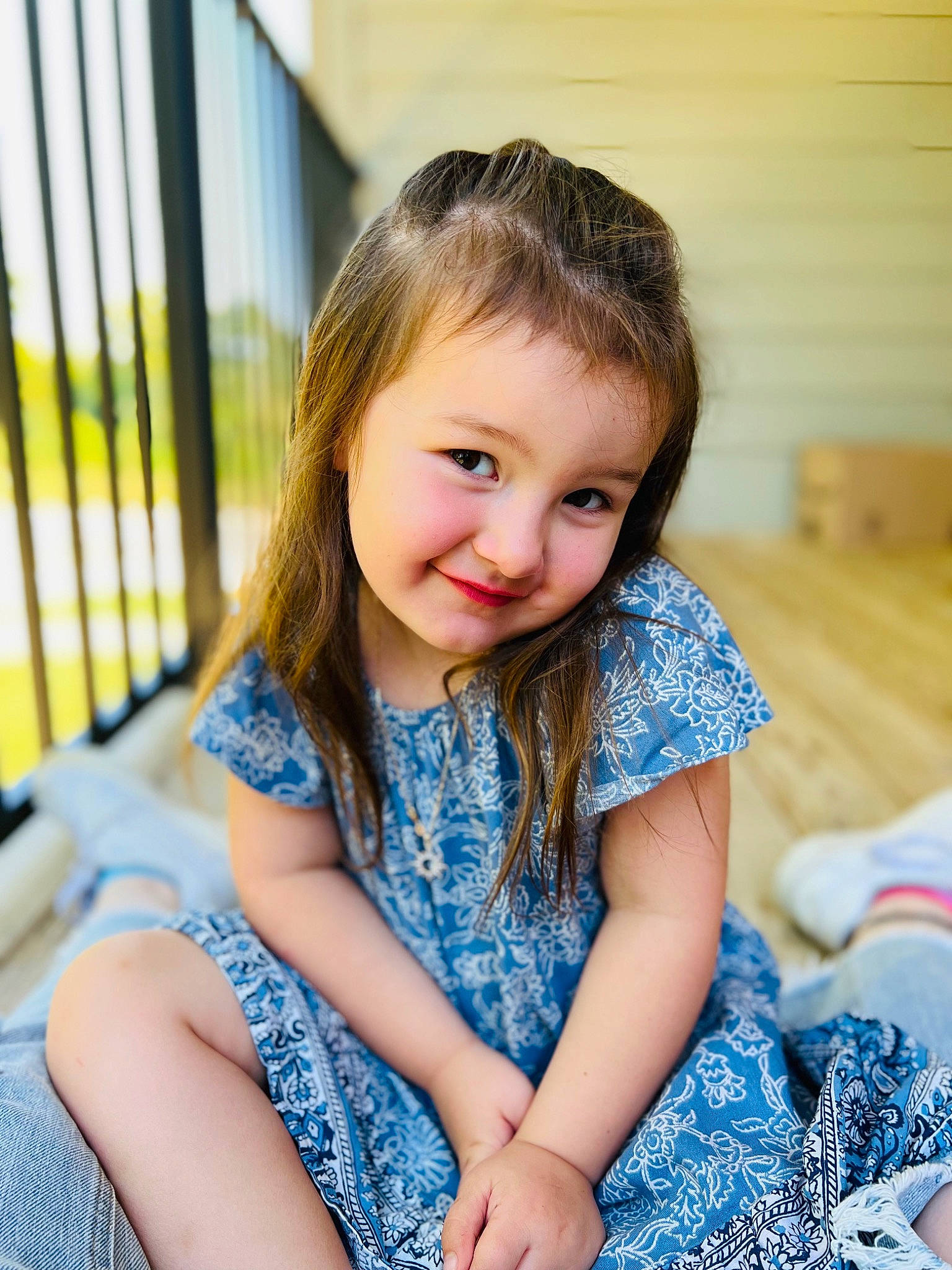 Emmalyn is registered to the contest to win money with this photo: azure, beauty, brown_hair, child, electric_blue, facial_expression, flash_photography, fun, grass, happy, iris, joy, leisure, pattern, person, recreation, shoulder, sitting, skin, smile