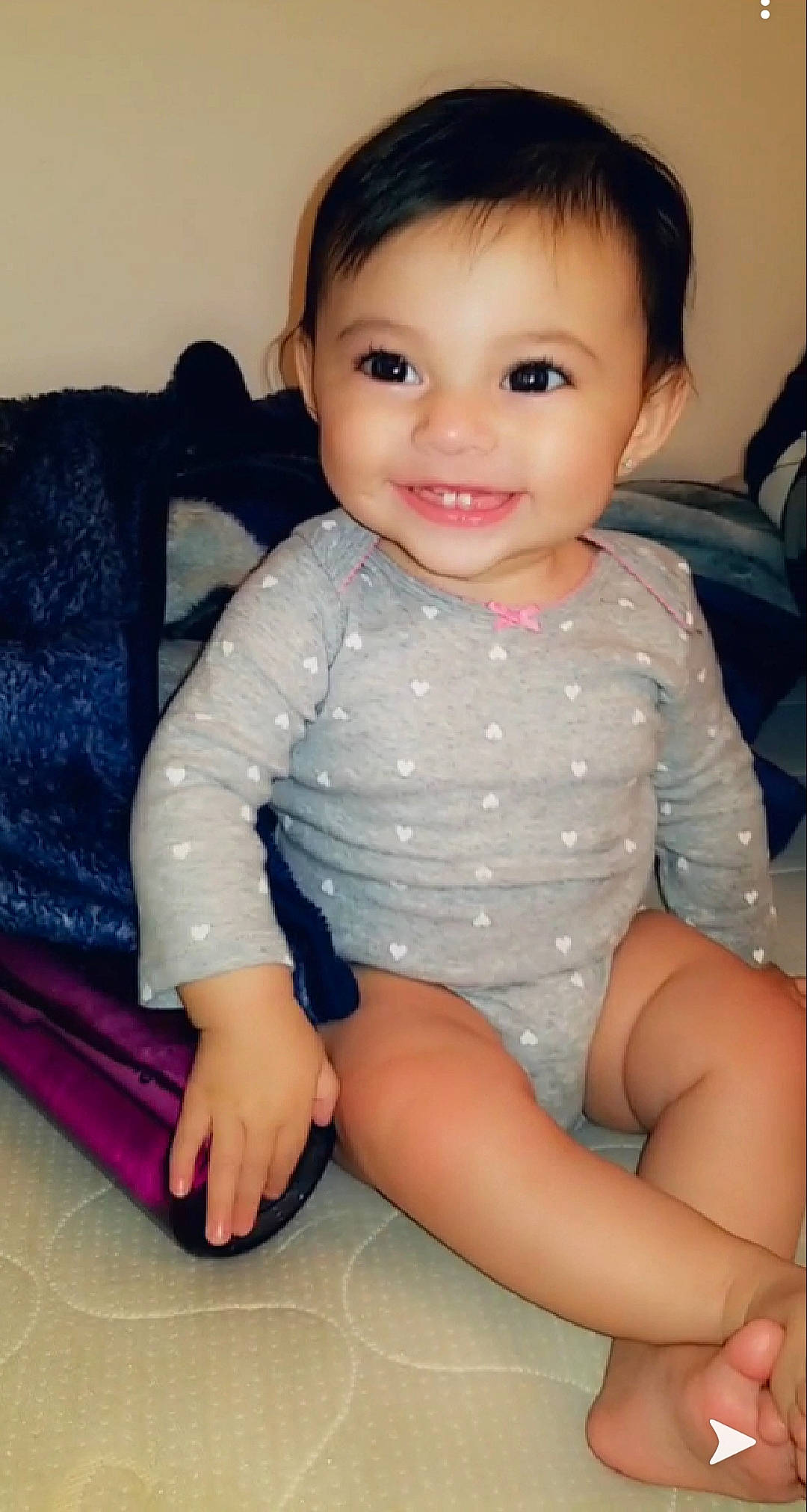 Valencia joined the competition — help win amazing prizes! baby, beauty, black_hair, cheek, child, chin, face, head, iris, joy, leg, lip, mouth, nose, person, sitting, skin, smile, thigh, toddler