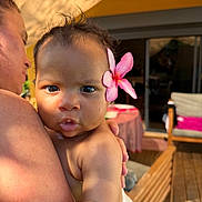 Zaya a rejoint le concours — aidez-le/la à gagner de superbes lots ! baby, child, flower, pink_flower, person, adult, arm, skin, outdoor, sunlight, table, chair, wooden_floor, home, portrait, cute, face, holding, expression, closeup