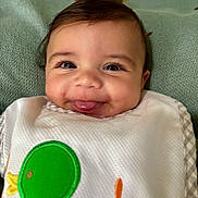 Myles is registered to the contest to win money with this photo: baby, babywear, bib, blanket, cheeks, child, closeup, clothing, cute, expression, eyes, face, green_bird_patch, happy, indoor, infant, portrait, smile, tongue, young