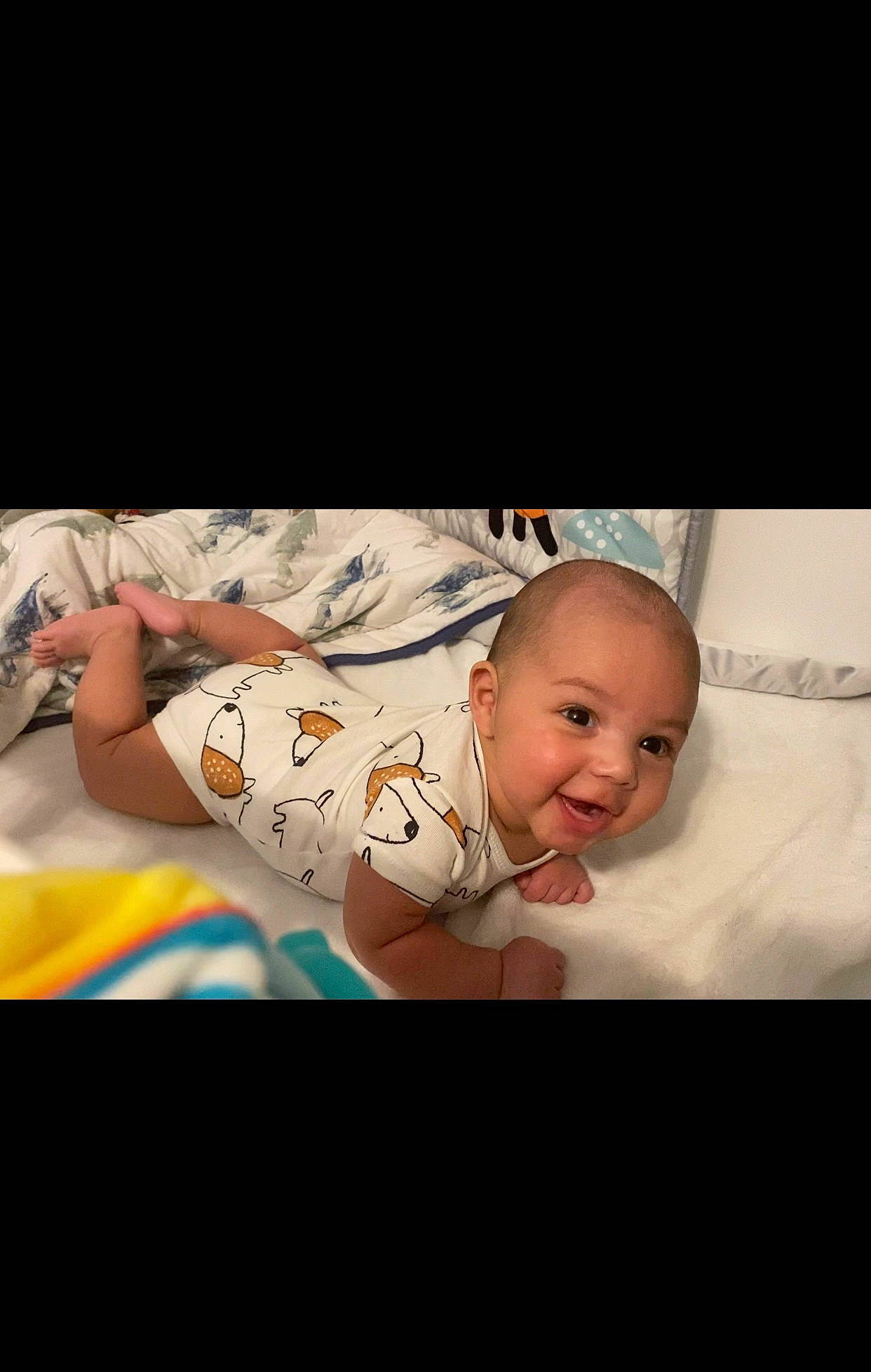 Derrick is registered to the contest to win money with this photo: baby, baby_products, baby_toddler_clothing, child, comfort, darkness, flash_photography, flesh, flooring, font, happy, linens, pattern, person, portrait_photography, room, sitting, sleeve, t_shirt, toddler