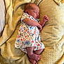 Eloise joined the competition — help win amazing prizes! newborn, baby, sleeping, blanket, floral_dress, infant, soft_texture, cozy, peaceful, cute, person, skin, foot, hand, indoors, rest, lying_down, comfort, toddler, portrait
