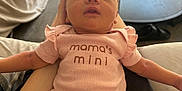 Eloise is registered to the contest to win money with this photo: arm, baby, baby_girl, blanket, casual, clothing, cute, human, indoor, infant, medicine_bottles, newborn, person, pink_onesie, relaxing, resting, sleepy, small, soft_light, table