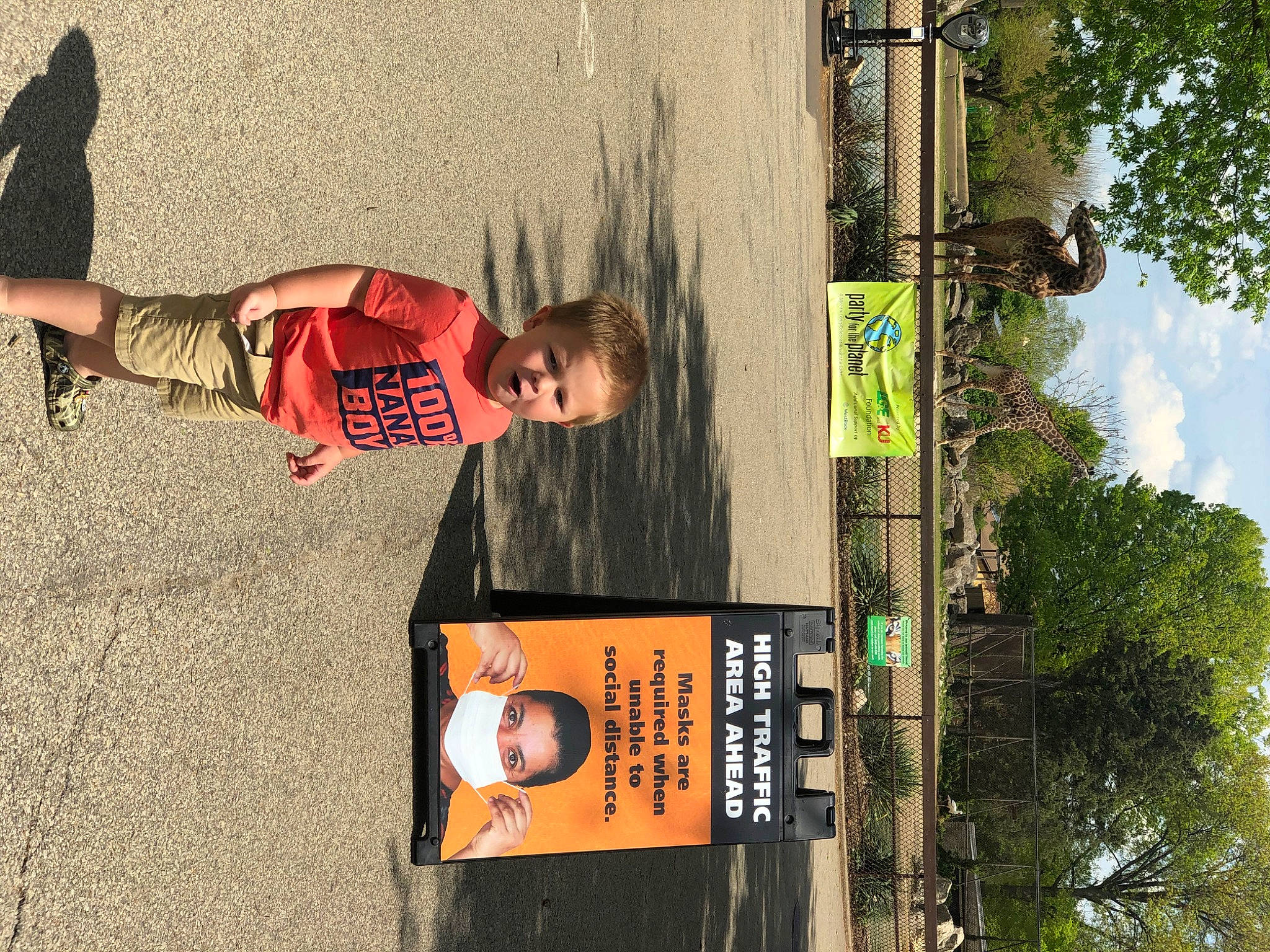 Koldyn joined the competition — help win amazing prizes! font, human_leg, knee, leisure, pedestrian, person, recreation, reflection, shadow, sign, signage, sky, street, t_shirt, tree, visual_arts, wood