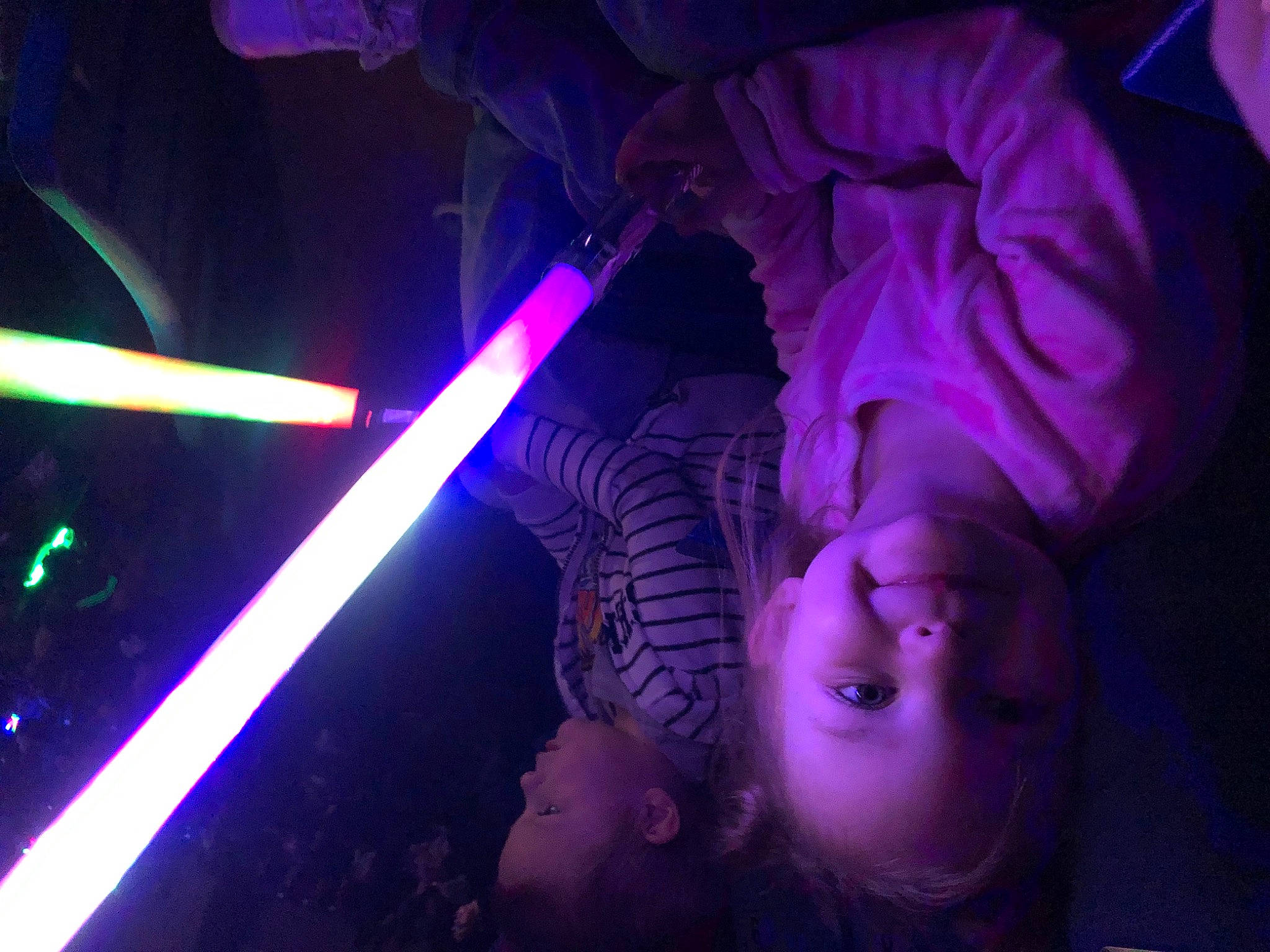 Karsyn is registered to the contest to win money with this photo: art, darkness, electric_blue, entertainment, event, fun, hat, joy, light, magenta, microphone, music, neon, performing_arts, person, pink, plant, purple, tree, violet