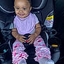 Noelani joined the competition — help win amazing prizes! baby, child, car_seat, pink_bows, bib, smile, leggings, ruffles, socks, happy, seatbelt, safety, infant, cute, hands, face, transportation, clothing, interior, car