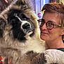 Ashtag participe au concours pour gagner de l'argent avec cette photo : animal, closeup, cozy, cuddly, cute, dog, face, friendship, fur, glasses, happy, head, human, indoor, person, pet, portrait, puppy, smile, warm