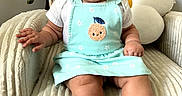 Kianna joined the competition — help win amazing prizes! armchair, baby, bib, chair, child, clothing, cushion, dress, embroidered, face, happy, home, indoors, infant, orange, photography, portrait, sitting, smiling, toys