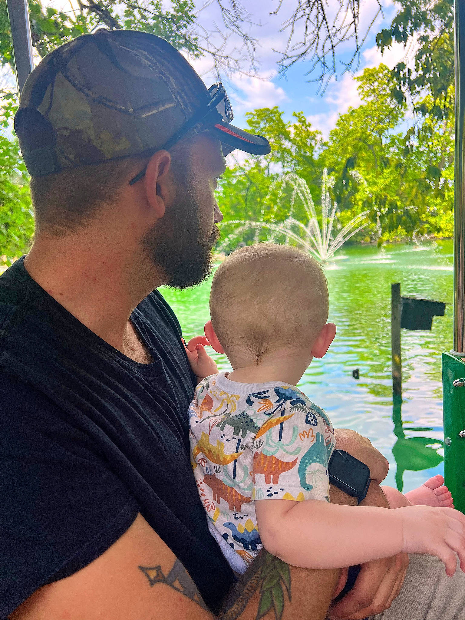 Colter is registered to the contest to win money with this photo: baby, baseball_cap, botany, cap, fun, grass, hair, hairstyle, happy, human_body, lake, leaf, leisure, muscle, person, sky, summer, toddler, tree, vertebrate