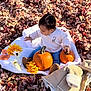 Miranda Castro is registered to the contest to win money with this photo: toddler, child, pumpkin, autumn_leaves, blanket, flowers, fall, outdoor, sweater, jeans, jacket, seasonal, nature, cute, baby, playful, sunlight, orange, yellow, cozy