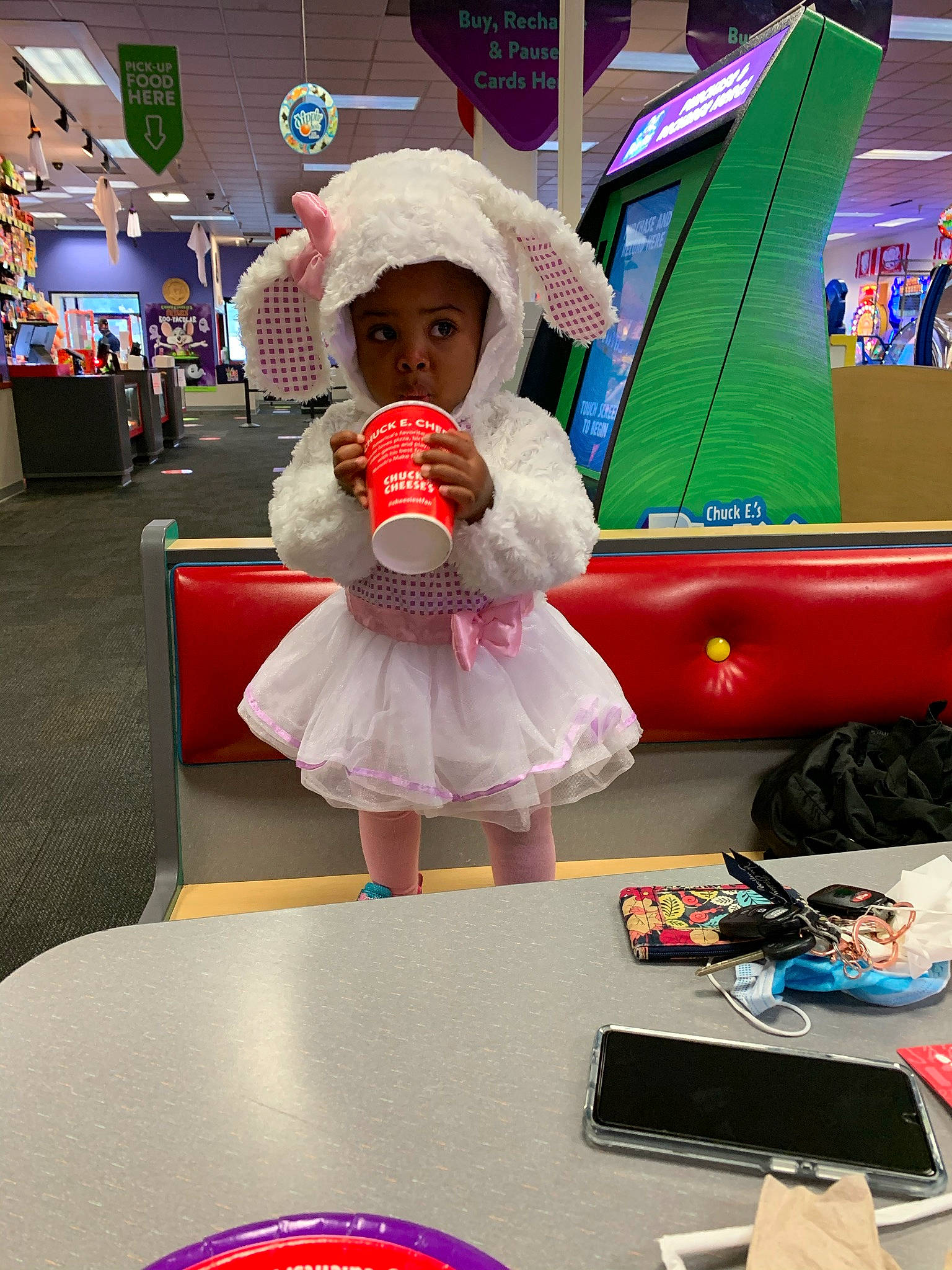 Kennedy is registered to the contest to win money with this photo: animation, child, costume, event, fashion_design, flooring, fun, hat, headwear, leisure, magenta, person, pink, play, purple, recreation, room, snapshot, stuffed_toy, sun_hat