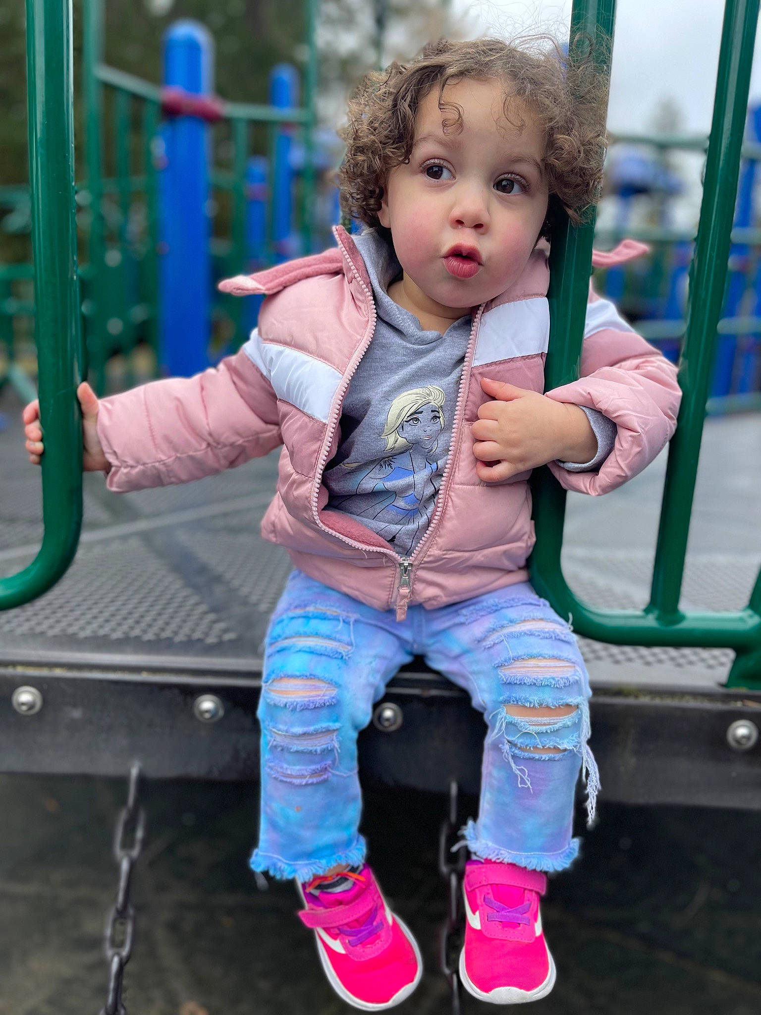 Brayleigh joined the competition — help win amazing prizes! baby, baby_toddler_clothing, blue, child, city, electric_blue, fun, grass, green, happy, leisure, outdoor_play_equipment, person, pink, playground, recreation, sitting, sock, standing, swing