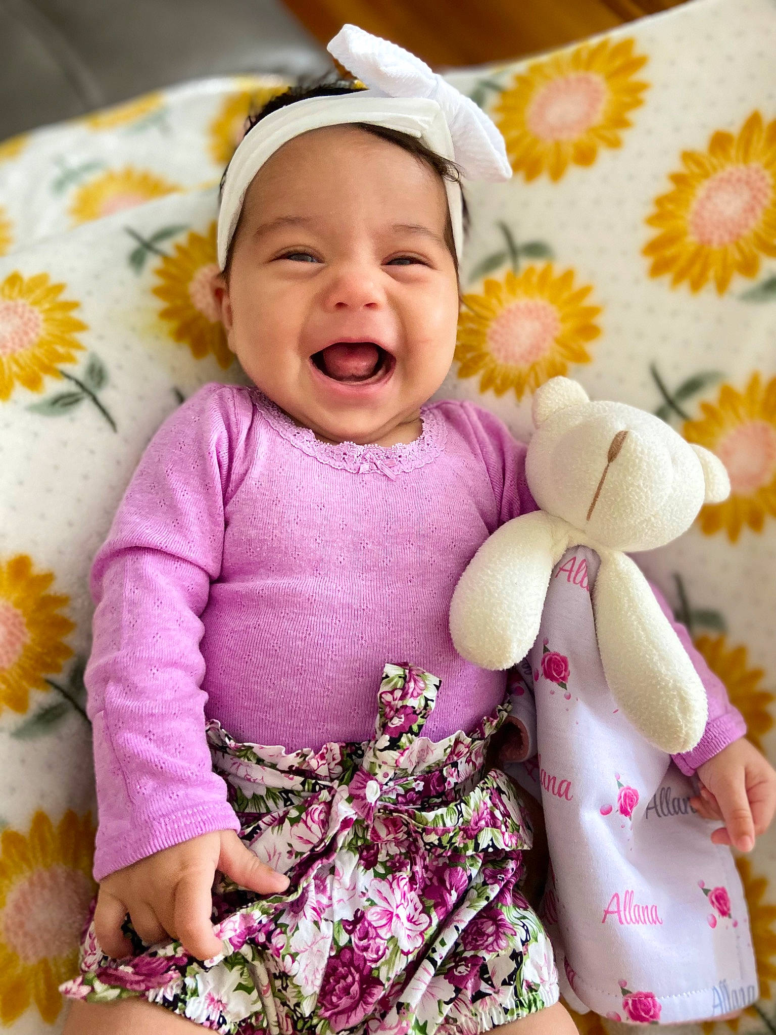 Allana is registered to the contest to win money with this photo: baby, baby_laughing, baby_products, baby_sleeping, baby_toddler_clothing, child, comfort, face, facial_expression, happy, headwear, linens, magenta, pattern, person, pink, purple, skin, sleeve, smile