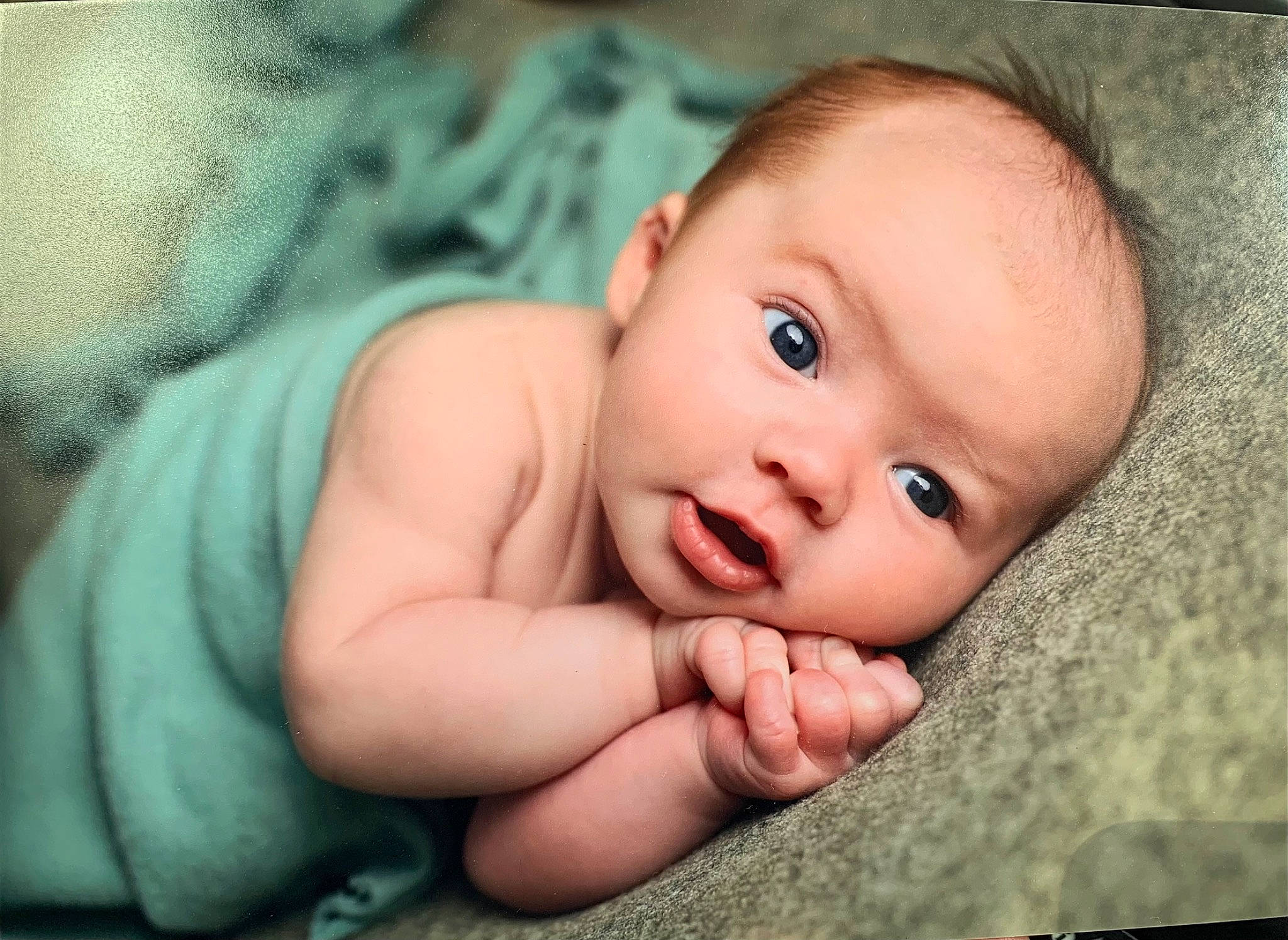 Miles is registered to the contest to win money with this photo: baby, baby_toddler_clothing, cheek, chin, close_up, comfort, eyebrow, flash_photography, gesture, grass, happy, iris, lip, mouth, nose, person, skin, smile, textile, toddler