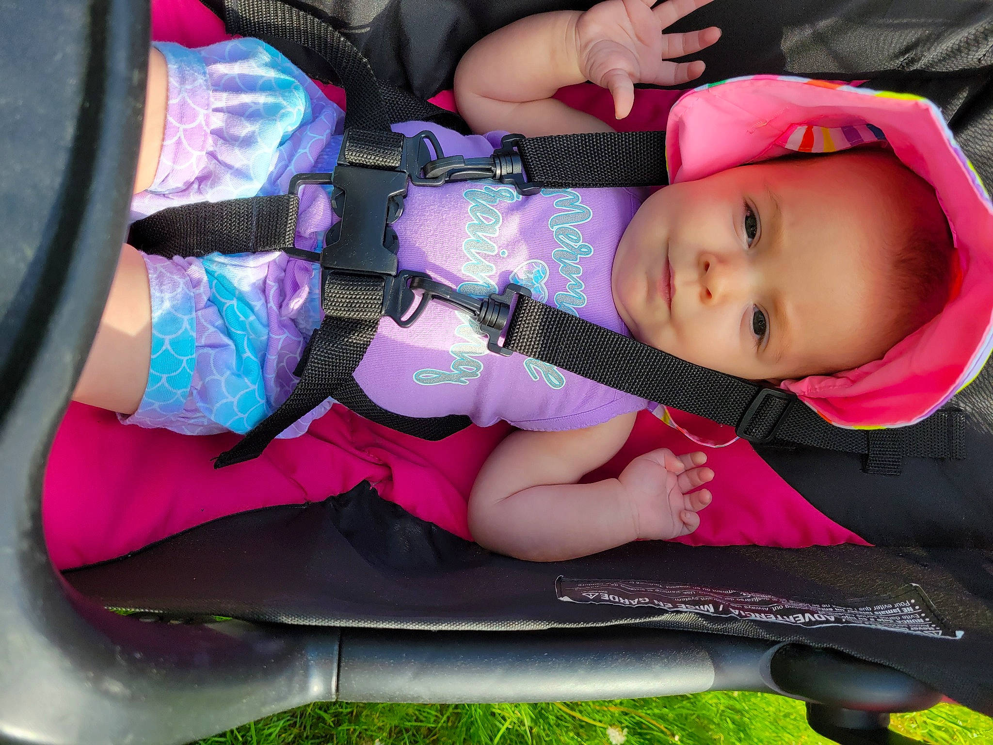 Kaylannah joined the competition — help win amazing prizes! auto_part, baby, baby_carriage, baby_products, baby_toddler_clothing, car_seat, carmine, child, comfort, grass, hat, lap, magenta, nail, pattern, person, pink, sitting, thigh, toddler