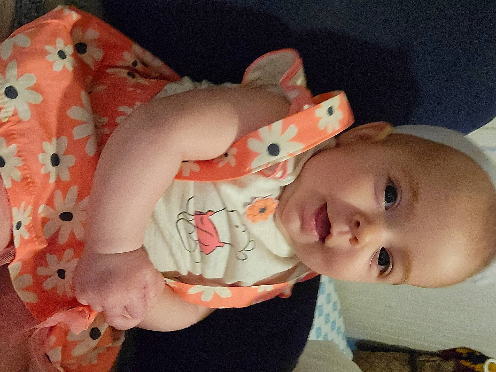 Kaylannah is registered to the contest to win money with this photo: arm, baby, baby_toddler_clothing, cheek, child, dress, finger, happy, headgear, human_body, lip, mouth, person, pink, red, skin, sleeve, smile, textile, toddler