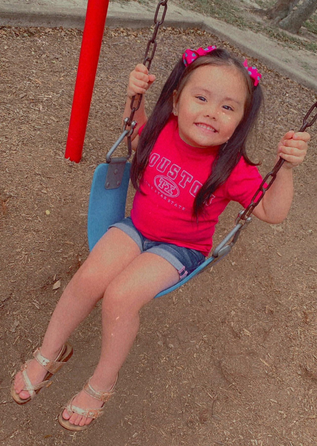 Mallorie joined the competition — help win amazing prizes! child, face, facial_expression, fun, happy, human_body, human_leg, joy, leg, leisure, magenta, person, pink, playground, shorts, skin, smile, summer, swing, thigh