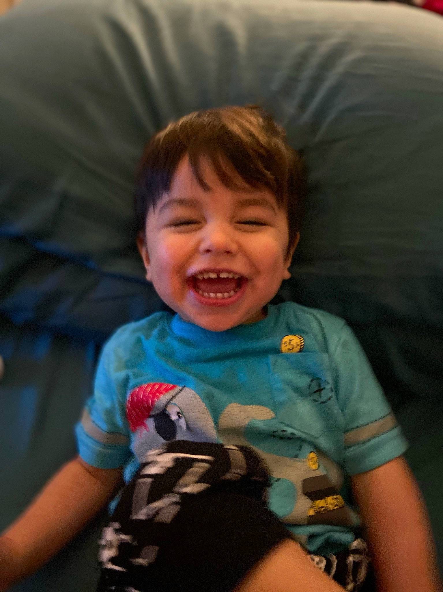 Jakob is registered to the contest to win money with this photo: arm, cheek, child, comfort, couch, elbow, flash_photography, fun, happy, iris, joy, lap, mouth, nose, organ, person, sitting, skin, sleeve, smile