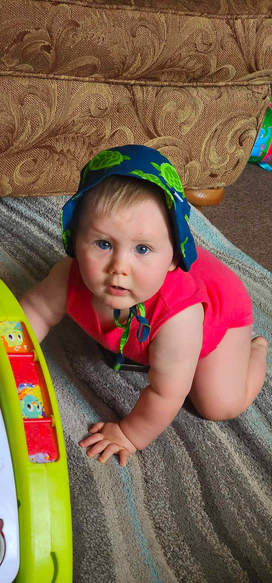 Elijah joined the competition — help win amazing prizes! baby, baby_toddler_clothing, child, fashion_accessory, flooring, fun, grass, happy, headband, headpiece, iris, jewellery, leisure, magenta, person, play, sitting, skin, toddler, vacation