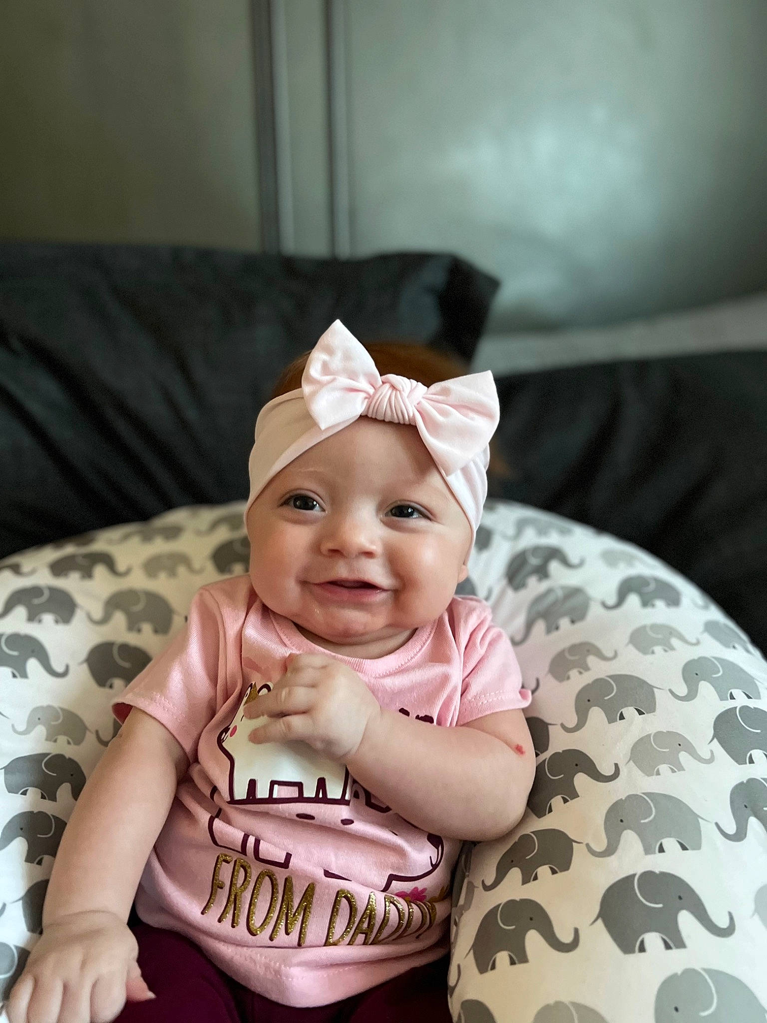 Alanii is registered to the contest to win money with this photo: baby, baby_laughing, baby_toddler_clothing, cap, child, comfort, fashion_accessory, flash_photography, fun, happy, headgear, headpiece, headwear, magenta, pattern, person, sitting, skin, sleeve, smile