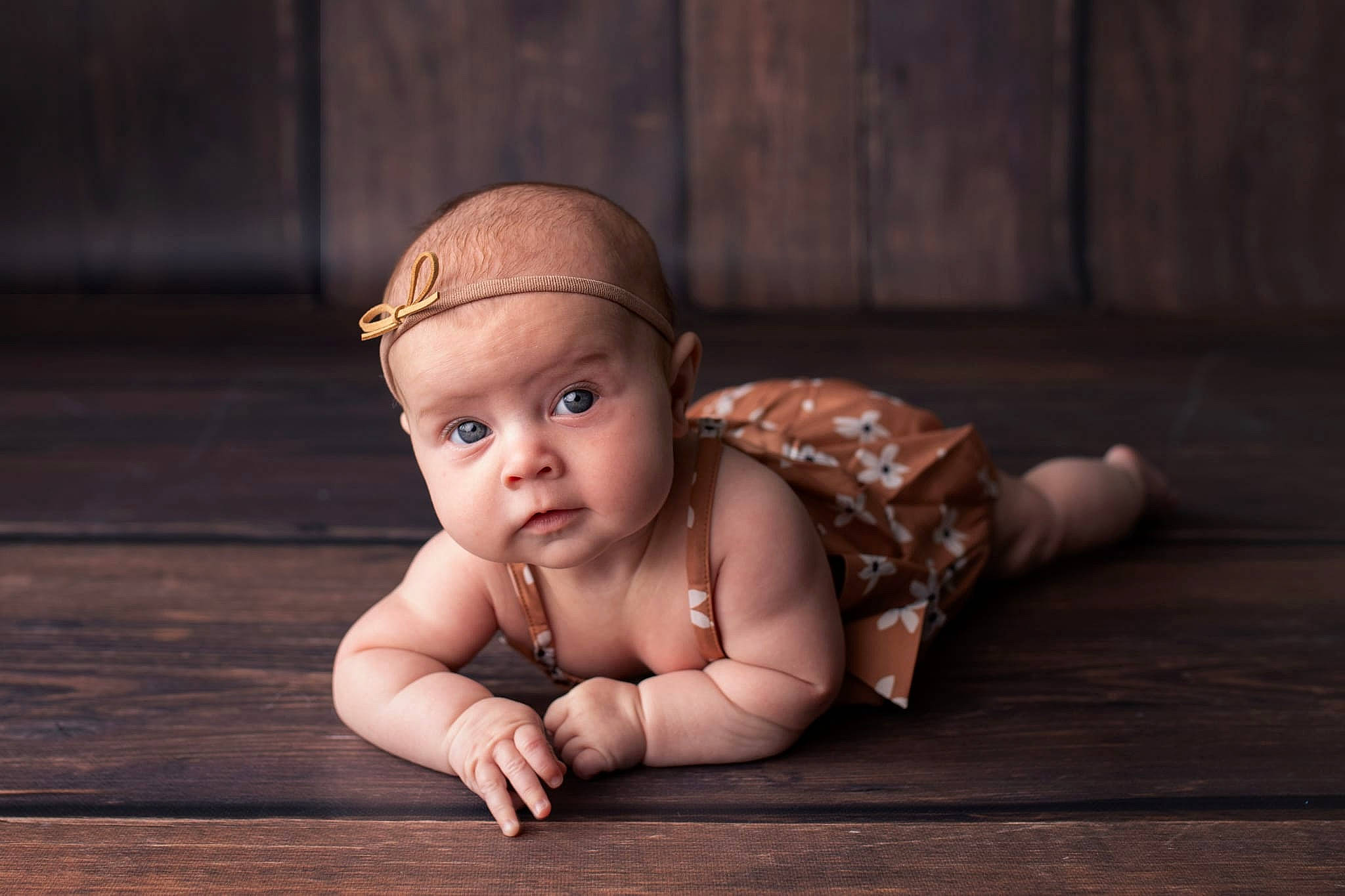 Mallory is registered to the contest to win money with this photo: baby, baby_toddler_clothing, crawling, darkness, eye, fashion_accessory, flash_photography, floor, flooring, foot, grass, happy, hardwood, human_leg, laminate_flooring, person, sitting, skin, toddler, wood